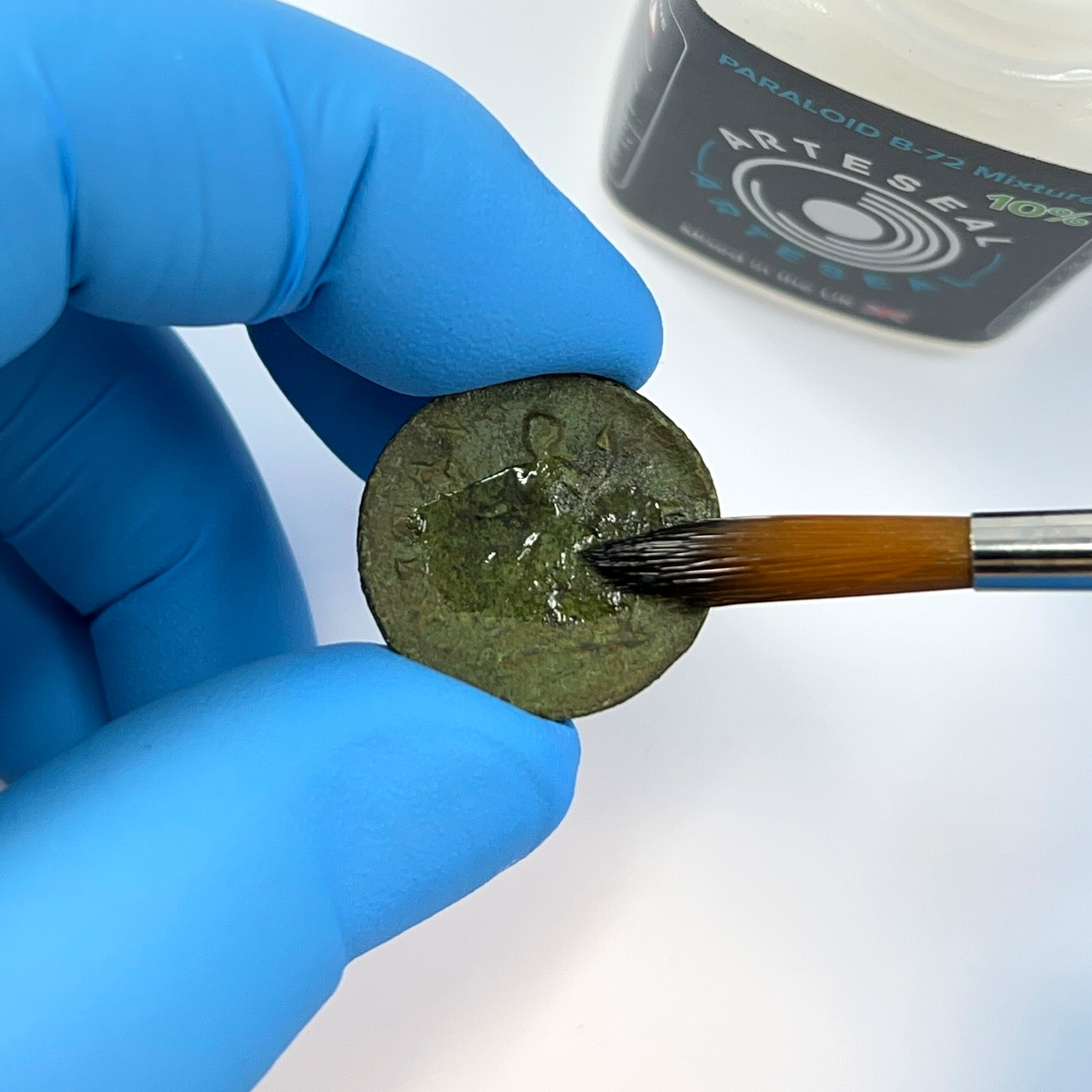 Brushing coin with ArteSeal
