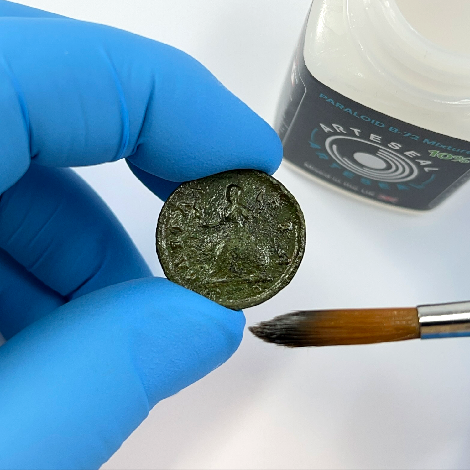Brushing coin with ArteSeal